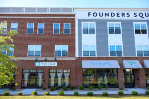 Founders Square mixed-use building with ground-floor storefronts
